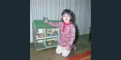 Girl with a dollhouse